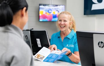 Image of child using membership card